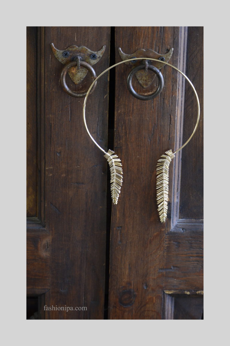 BCBG gold feather necklace.