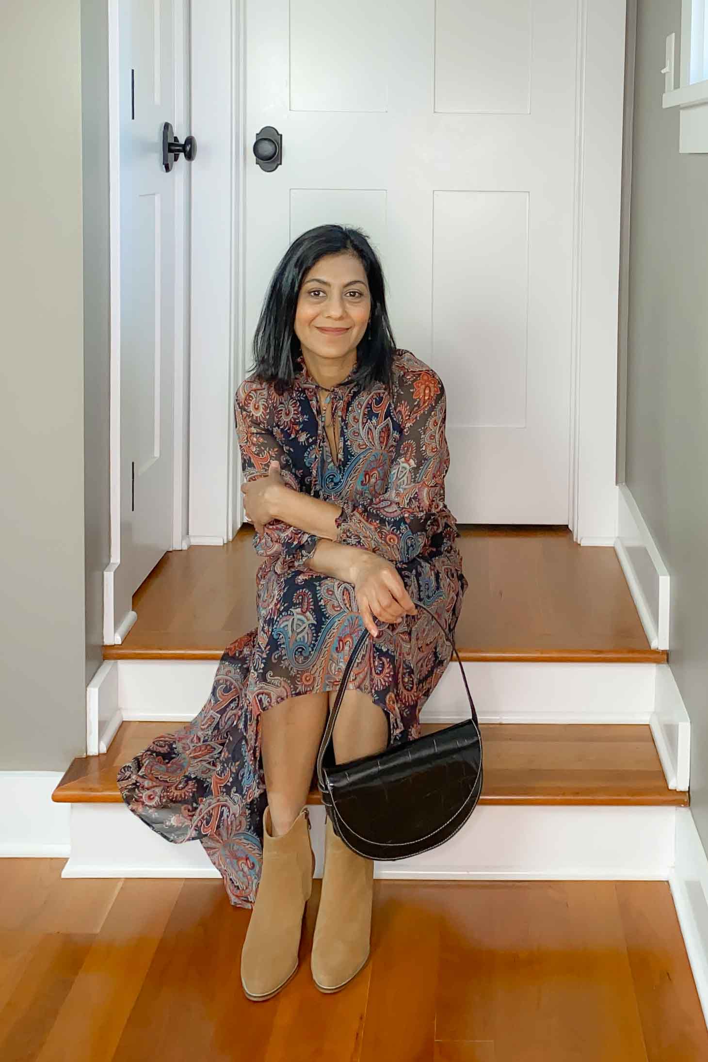 Paisley print midi dress, tan boots and black half-moon handbag 
