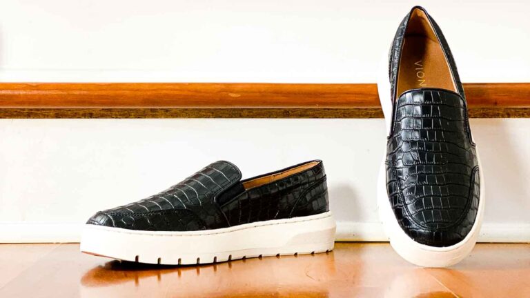 Vionic Dinora black leather croc sneakers with platform soles.