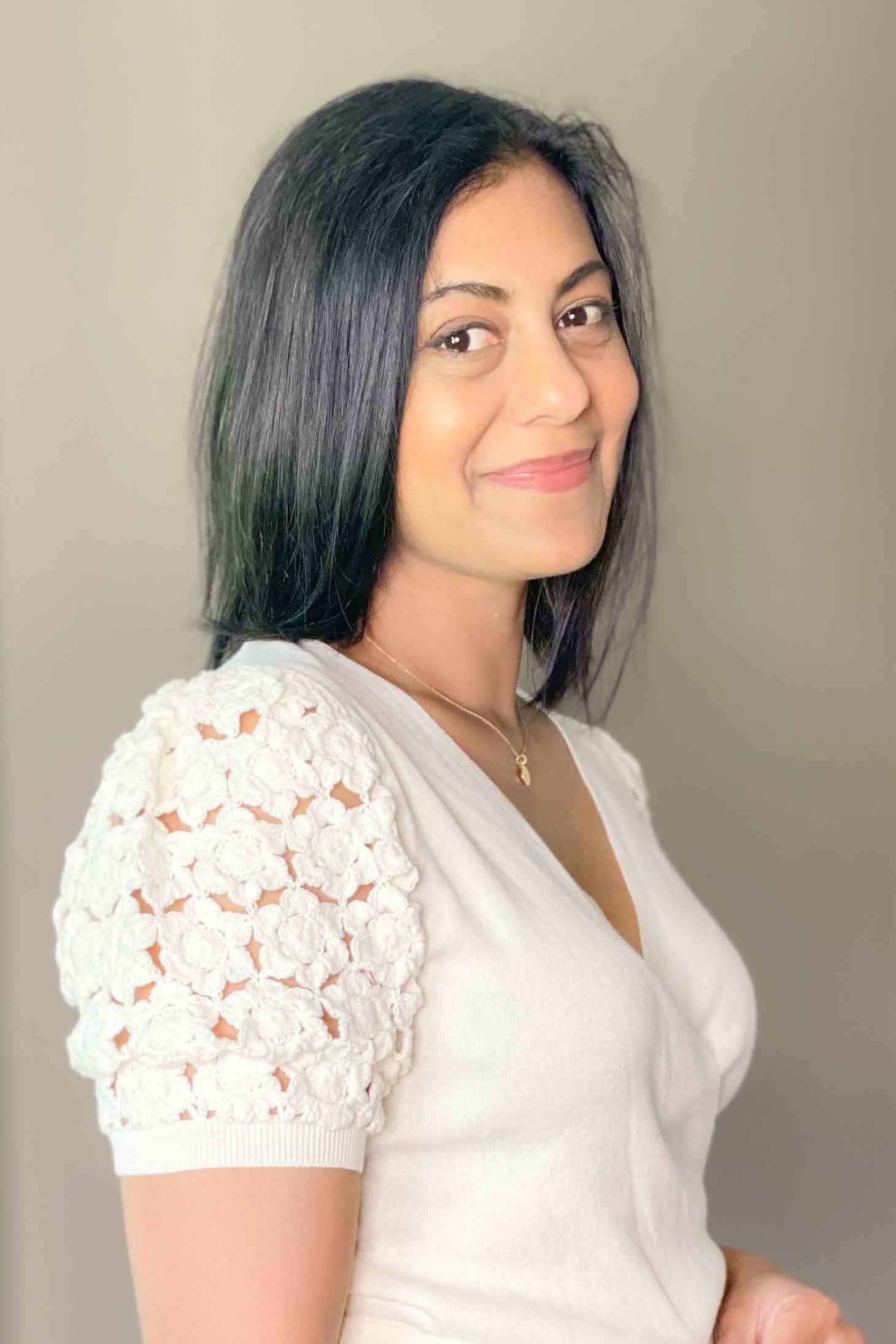 Fashionipa in a wrap sweater with crochet sleeves