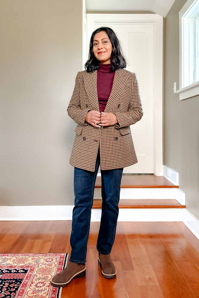 Fashionipa (Nipa) wearing a brown corduroy jeans with a burgundy sweater and a cow print handbag.