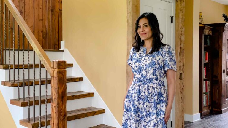 Fashionipa wearing a blue and white print dress