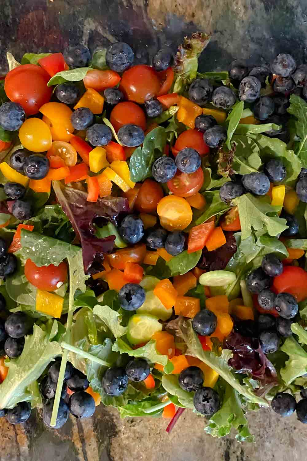 Closeup of salad with tomatoes and blueberries 