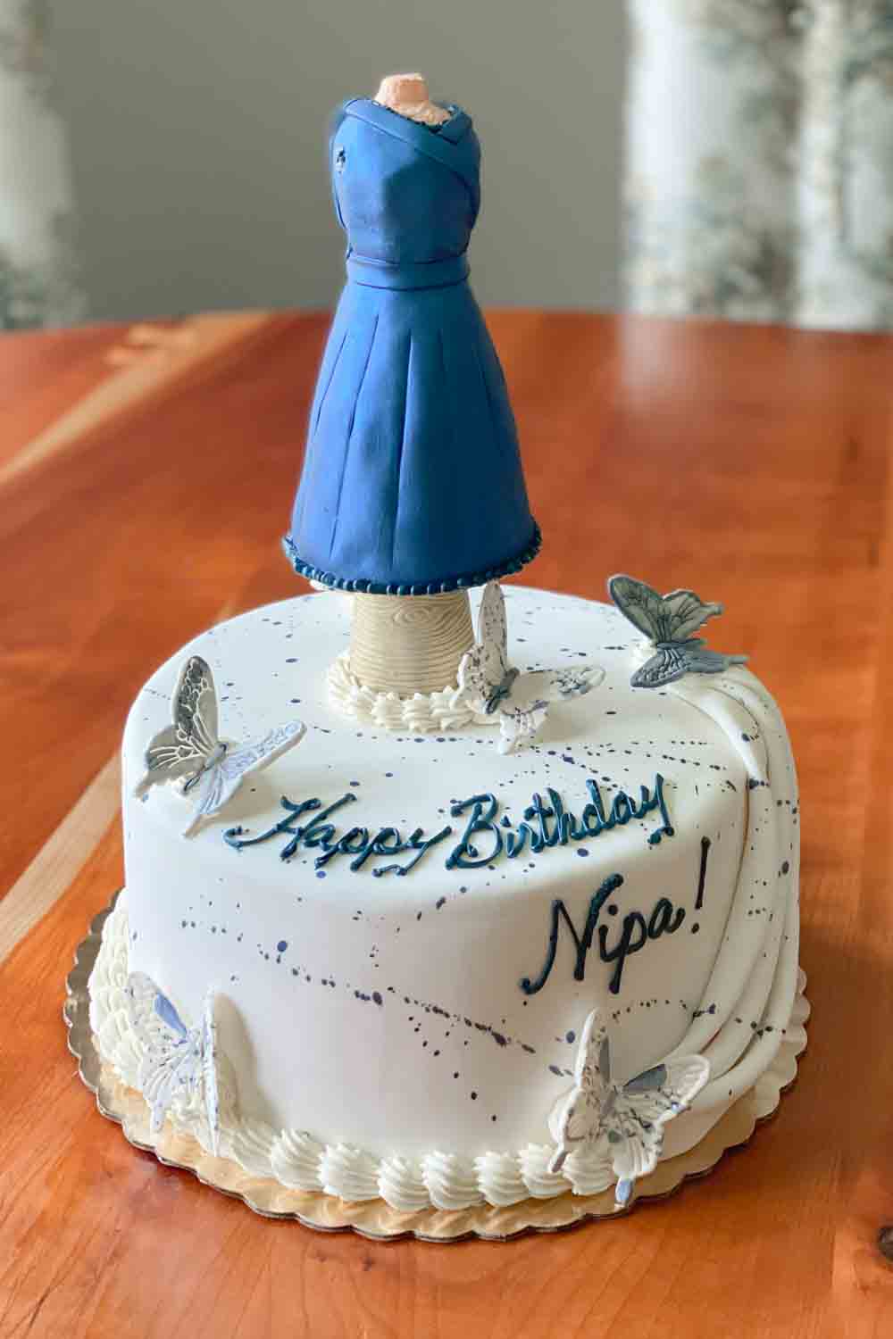 Birthday cake with butterflies and "Happy Birthday Nipa"
