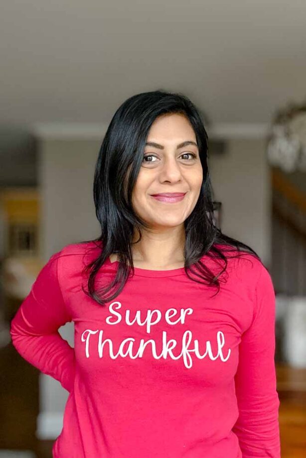 Fashionipa (Nipa) wearing a hot pink t-shirt with Super Thankful embroidered across the front