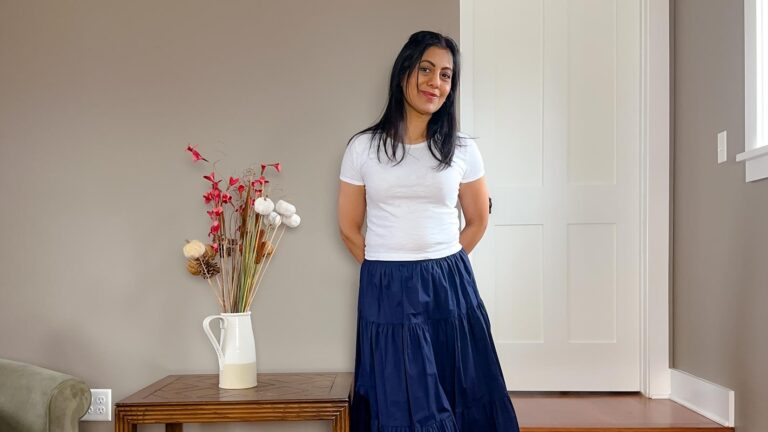 Fashionipa (Nipa) wearing a white cropped tee and navy skirt.