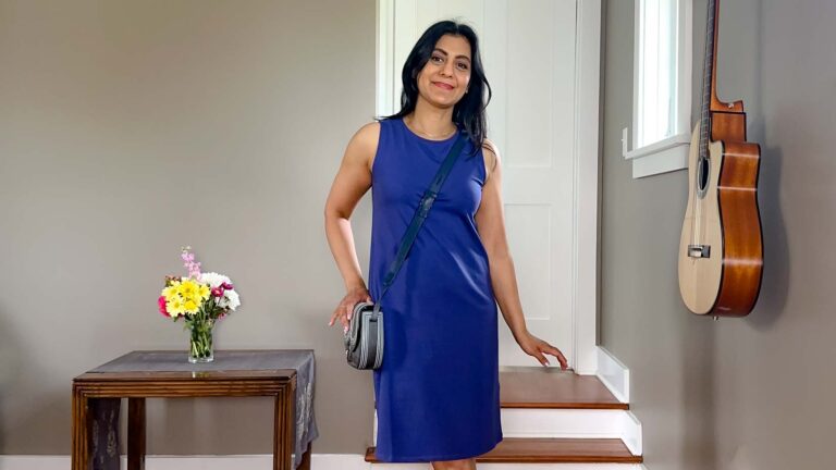 Fashionipa (Nipa) wearing a purple tank dress with sandals and a crossbody bag.