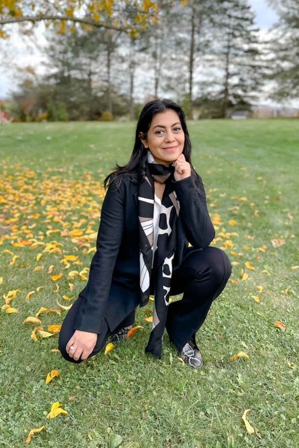 Fashionipa (Nipa) wearing black blazer, black pants, a white blouse and printed scarf.