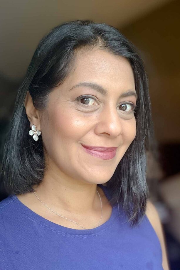 Fashionipa (Nipa) wearing oversized flower stud earrings...