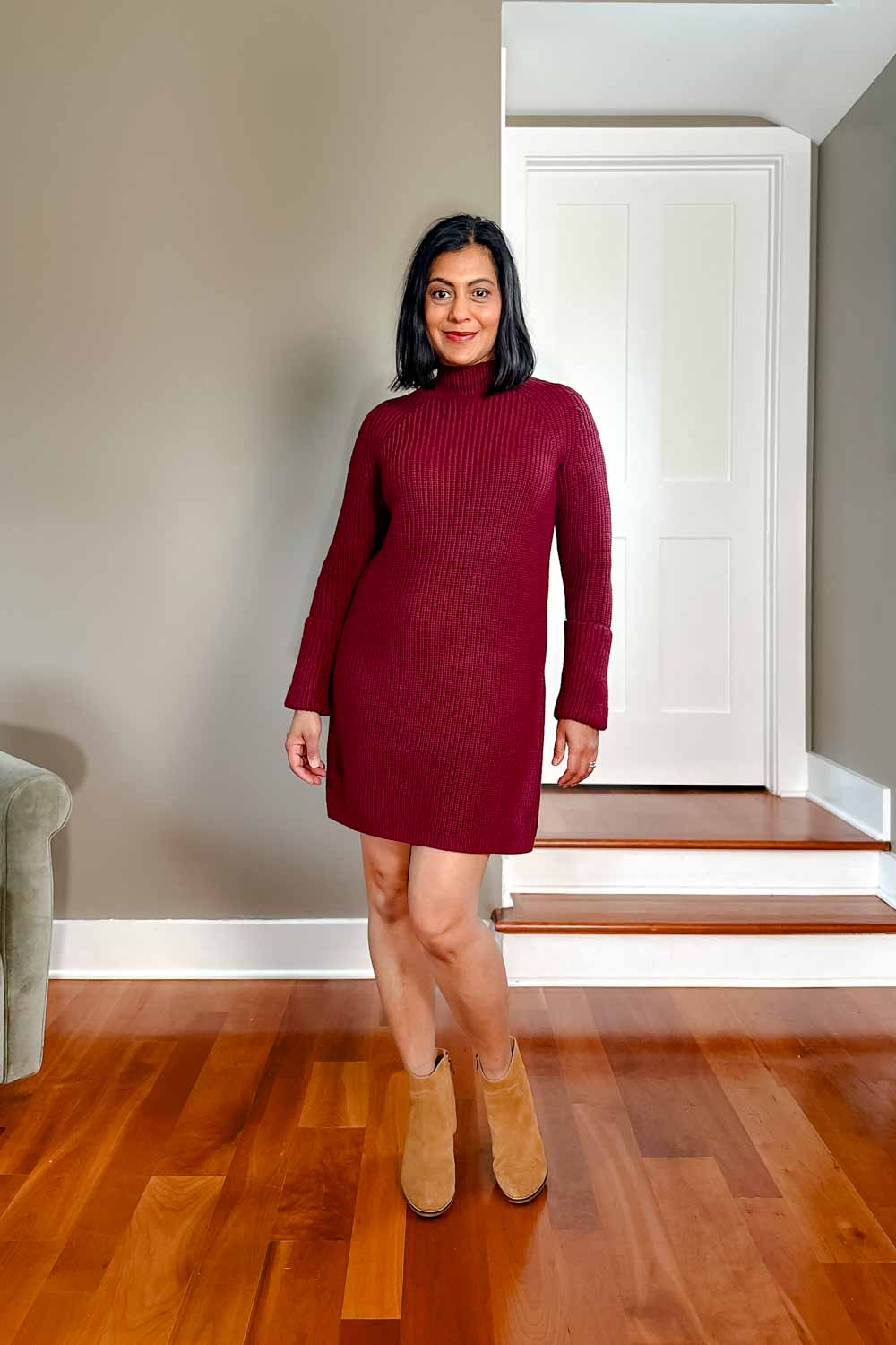 Fashionipa (Nipa) wearing a burgundy mini sweater dress with toffee colored boots. 