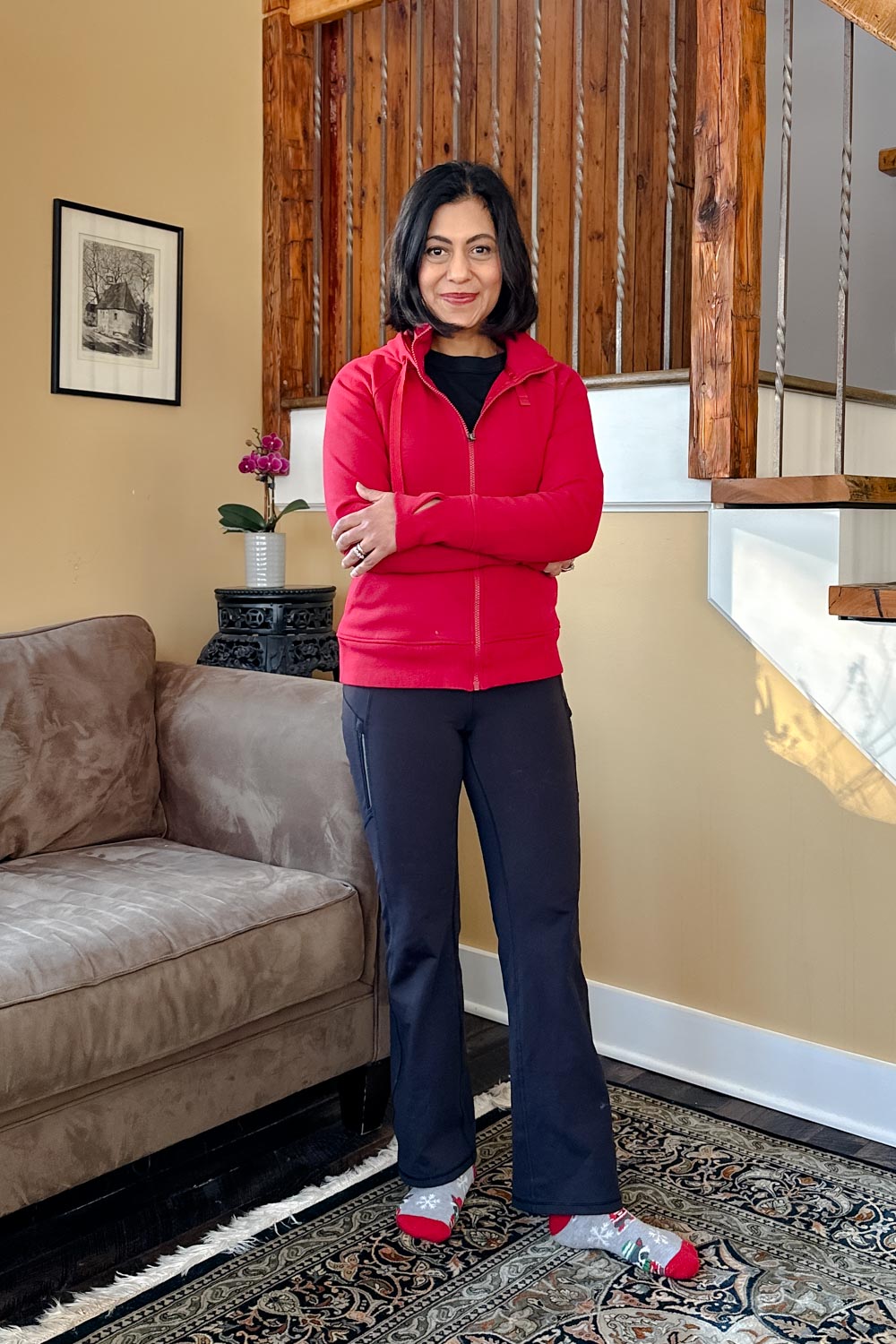 Fashionipa (Nipa) wearing black jeans, a red hoodie, black flared pants, and cozy socks.