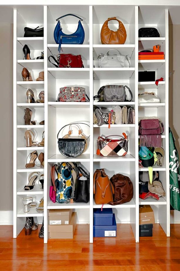 A white shelf with handbags, shoes and hats.  