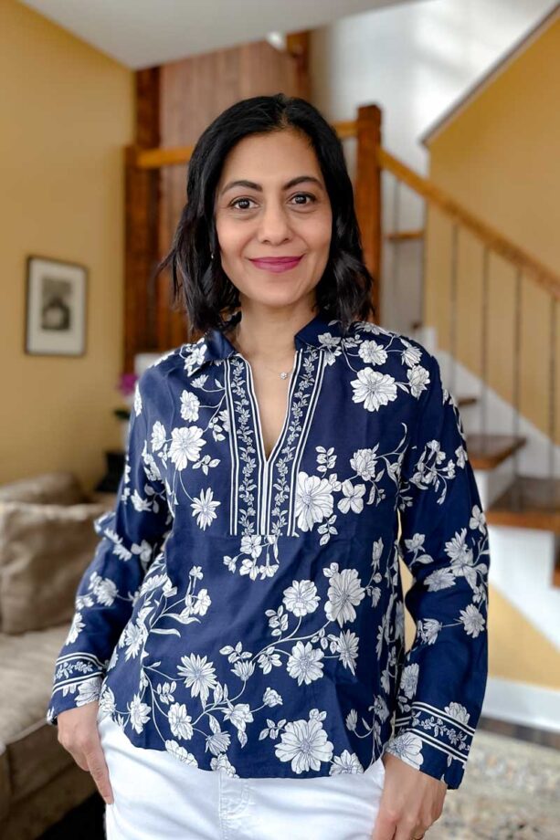 Fashionipa (Nipa) wearing a blue and white print floral popover top.