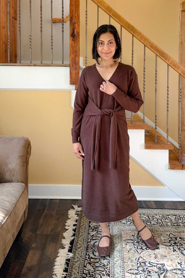 Fashionipa (Nipa) wearing a brown sweater dress with ties at the waist.