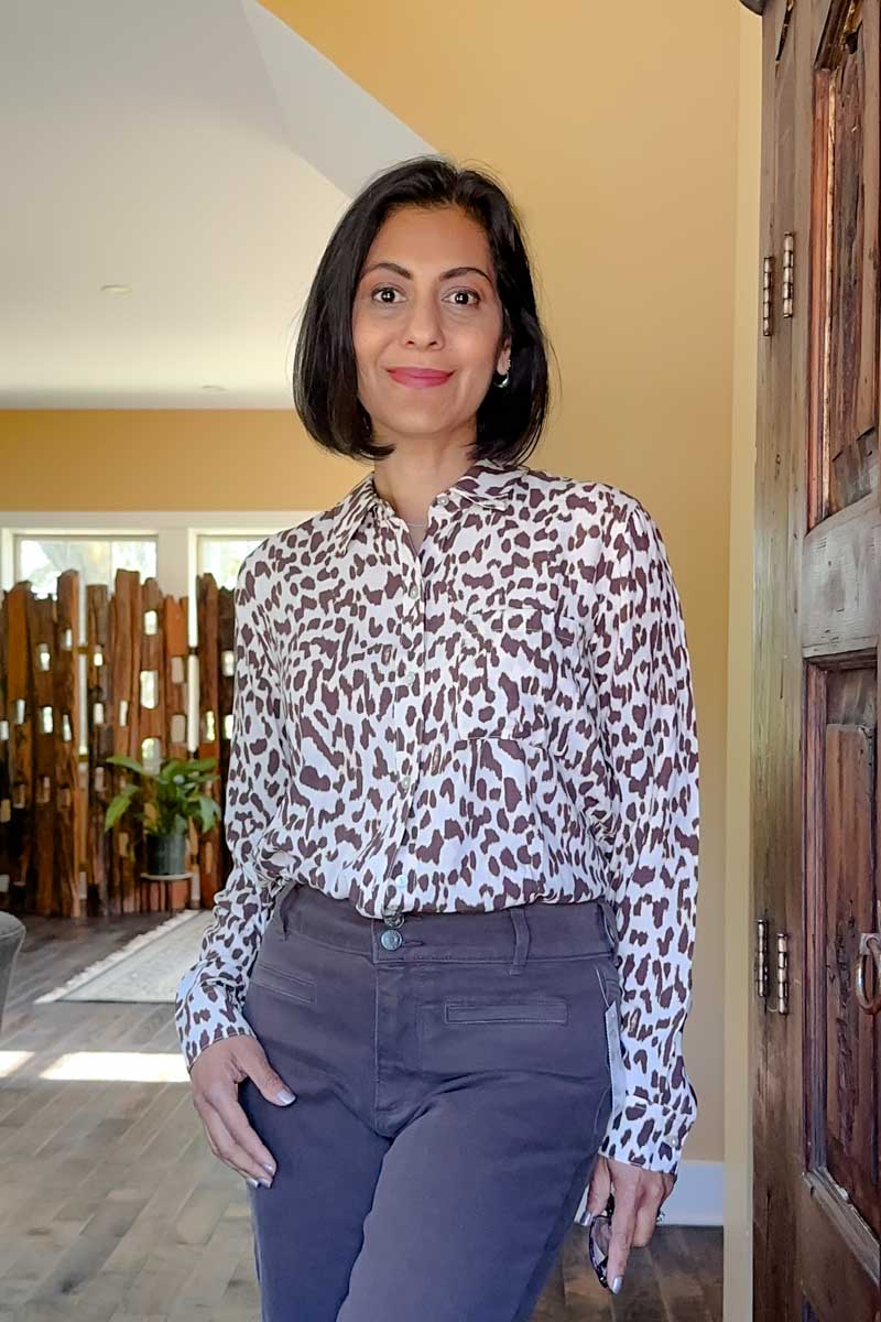 Fashionipa (Nipa) wearing a jaguar print blouse in brown and white.