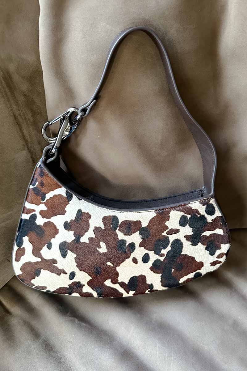 Asymmetrical cow print handbag. 