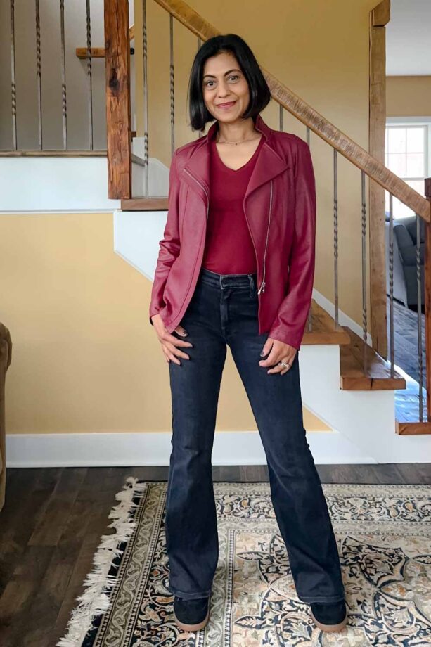 Fashionipa (Nipa) wearing a black jeans and sneakers, with a burgundy t-shirt and faux leather jacket.
