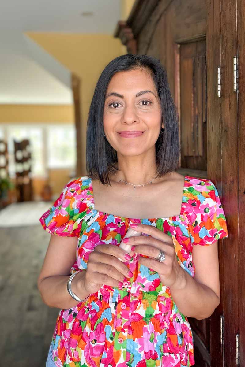 Fashionipa (Nipa) wearing a pink floral blouse and Westman Atelier lipstick in the color Blushy Nude.