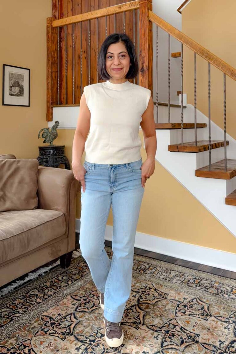 Fashionipa (Nipa) wearing light blue jeans with a cream sleeveless mock neck sweater...
