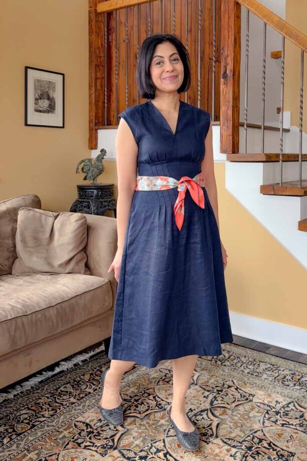 Fashionipa (Nipa) wearing a tangerine scarf with a blue dress.