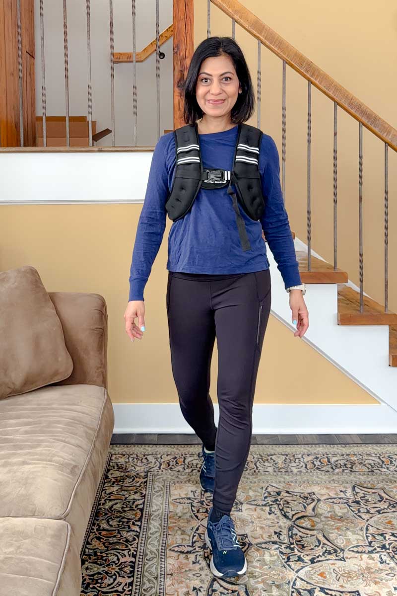 Fashionipa (Nipa) wearing a weighted vest with a blue shirt, black leggings and sneakers.