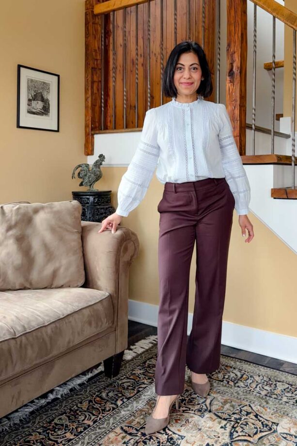 Fashionipa (Nipa) wearing a light blue blouse with pintucks and lace trim with gray wideleg pants and gray pointed toe heels.