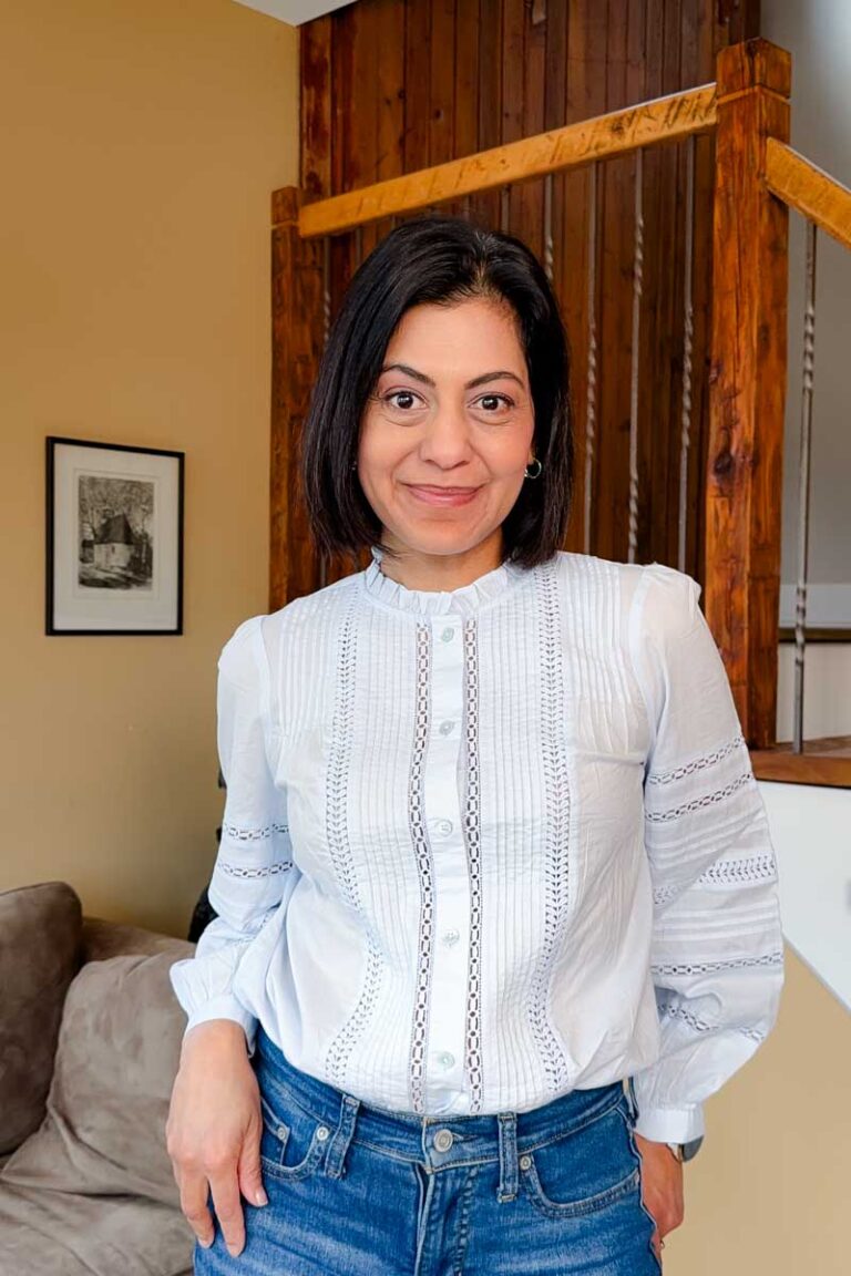 Fashionipa (Nipa) wearing a light blue blouse with pintucks and lace trim.