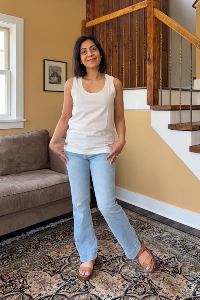 Fashionipa (Nipa) wearing an ivory tank top over jeans.