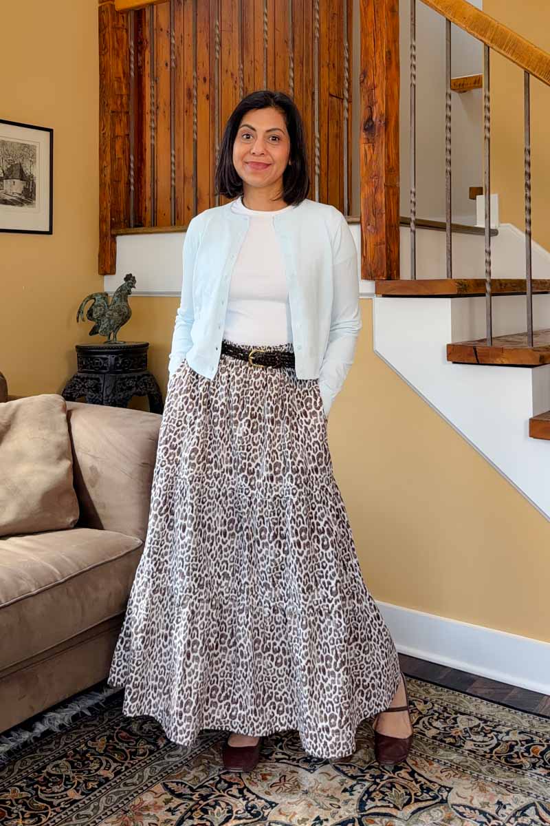 Fashionipa (Nipa) wearing a blue cardigan over a white tee, with an espresso print maxi skirt, and chocolate ballet flats.