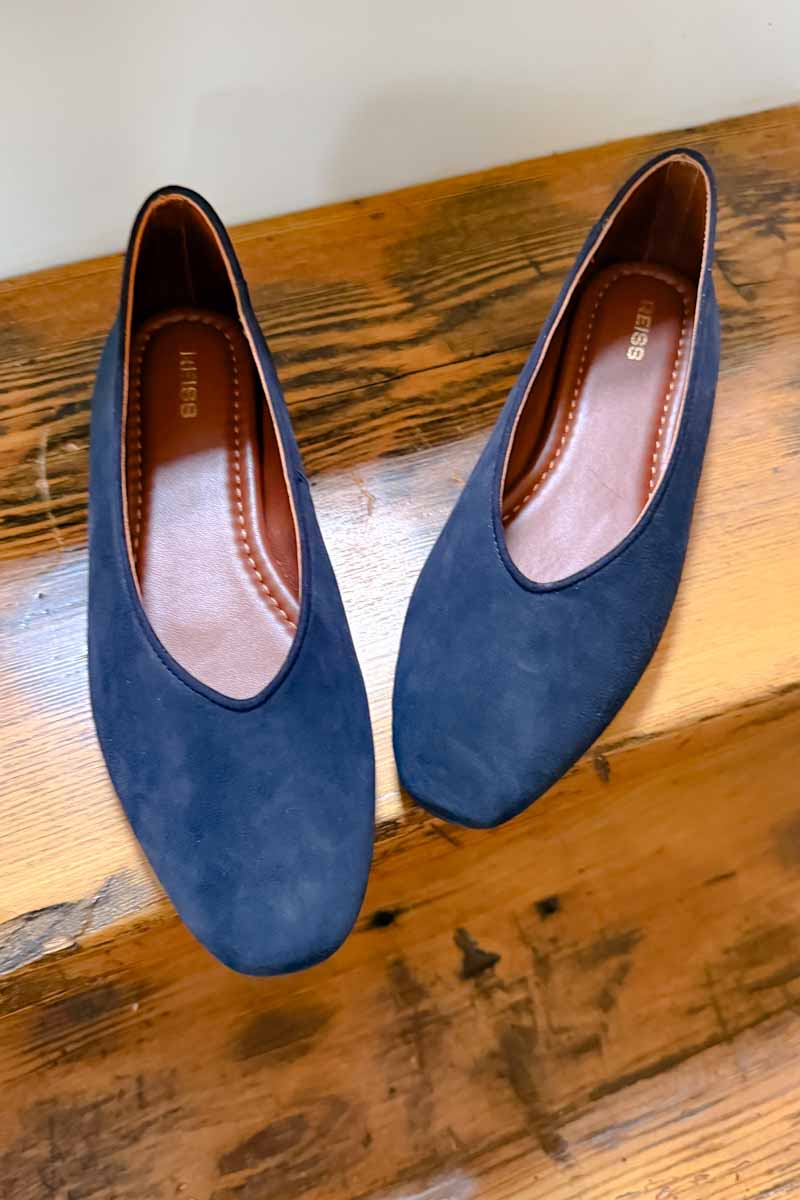 High-vamp ballet flats in navy suede.