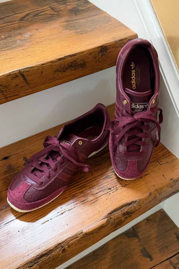Burgundy Adidas Tokyo sneakers.