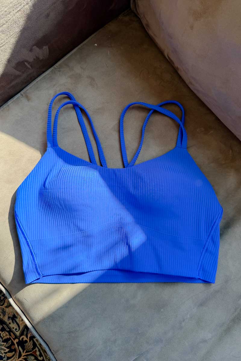 A blue Lululemon Bra on a couch