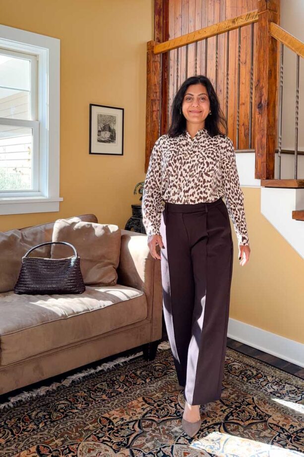 Fashionipa (Nipa) wearing dark brown ponte trousers with an animal print blouse and brown boots.
