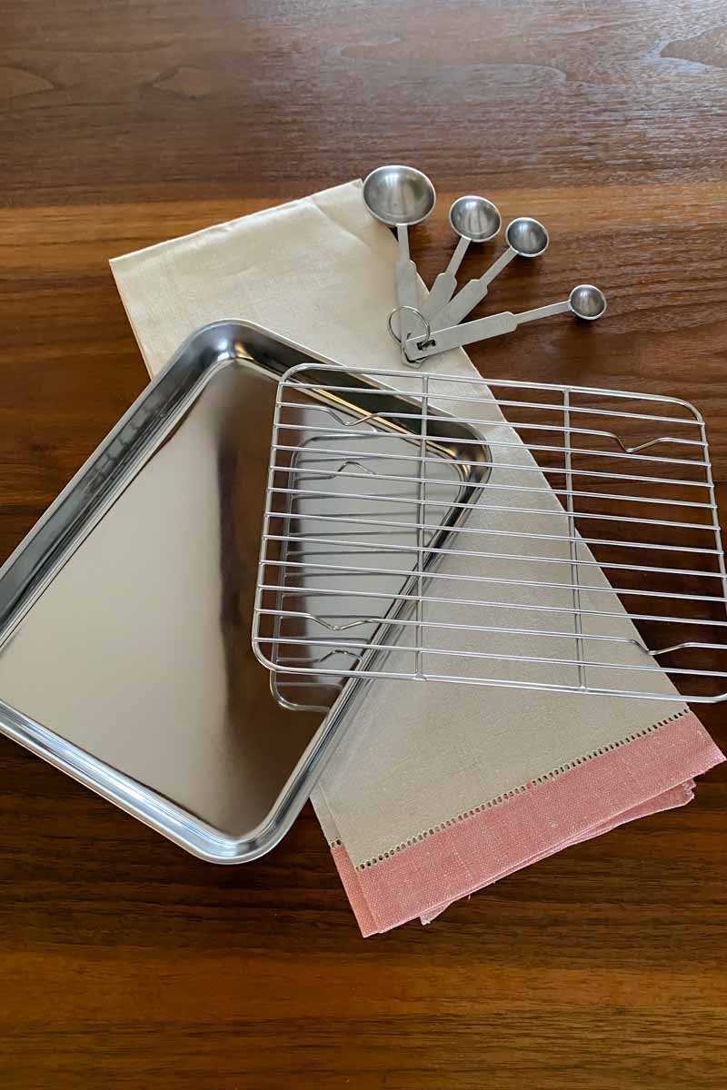 Stainless steel baking sheet with rack and measuring spoons...
